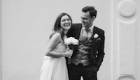 a black and white photo of a bride and groom